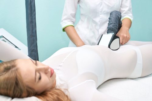 woman on table going through non-invasive body sculpting